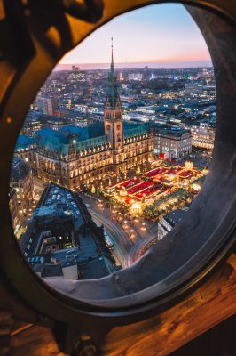 Top view of illuminated Christmas market on townhall square in advent time, Hamburg, Germany.
